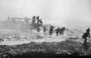 Churchill (far right) emerging from his landing craft, broadsword in ...