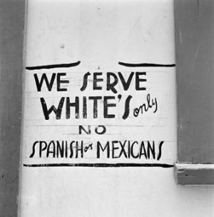 sign saying: we serve white's only, no spanish or mexicans