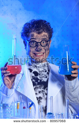 theme funny crazy scientist is working in a laboratory stock photo