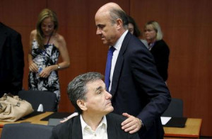 Spain's Economy Minister Luis de Guindos greets Greek Finance Minister ...
