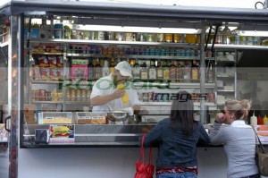 fast food stall man making hotdogs for female customers in santa cruz ...