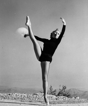 Dancer Poses In Front Of Symbol Of Nuclear Destruction
