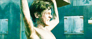 ... Connell as Louis Zamperini in Unbroken GIF lifting thing over his head