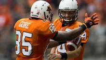 Gore, left, celebrates his touchdown reception with quarterback Travis ...