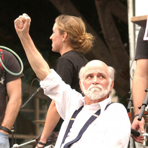 Ron Kovic -standing with the younger Vets