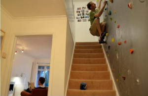 Climbing wall in house replaces stairs.
