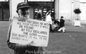 God wants us all to be Saved., Picture of a beggar holding a board ...