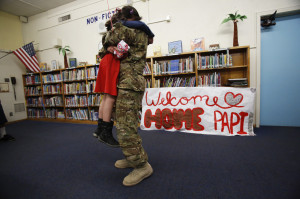 California Army National Guard helicopter pilot David Duran hugs his ...
