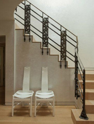Laura Ziskin's Home) The custom railing incorporates bronze panels ...