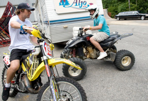 with travis travis showing a 1 bill autographed by travis pastrana