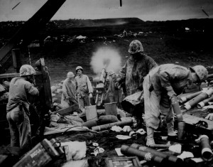 Across the litter on Iwo Jima's black sands,