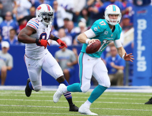 Mario Williams Ryan Tannehill 17 of the Miami Dolphins is chased by