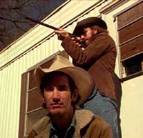 to R. Townes and Rex Bell with BB gun, on the front porch of Townes ...