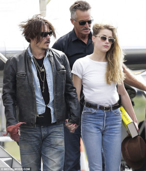 Together again: Johnny Depp and Amber Heard held hands as they arrived ...