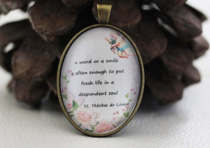 St. Therese of Lisieux Quote: A word or a smile.. - Catholic Medal ...