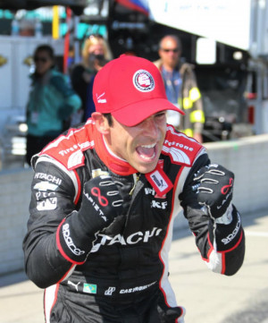 Associated Press Driver Helio Castroneves reacts after exiting his