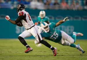 Atlanta Falcons wide receiver Eric Weems (14) avoids the tackle of ...