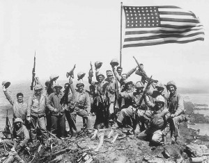 ... Marines cheer after raising the American flag on Iwo Jima
