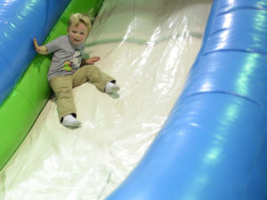Lawson Taylor zips down a slide Saturday at the Jack Anderson