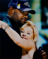 Leigh Anne Tuohy congratulates Michael Oher at the 2009 NFL Draft.