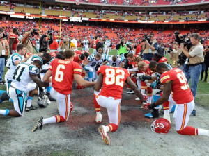 Chiefs and Panthers players kneel for a prayer after the game at ...