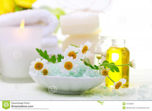 Spa relaxation theme with flowers, bath salt, essential oil, towels ...