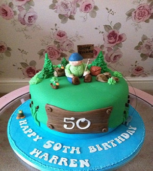 Fishing theme cake with hand modelled figure and little ducks for a ...