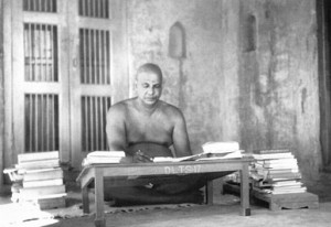 Swami Sivananda at his desk