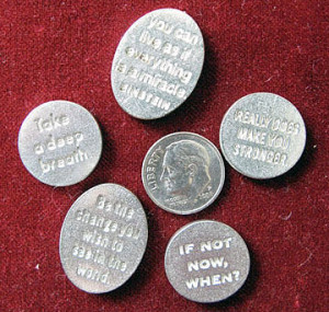 dime is used to demonstrate the size of the tokens.