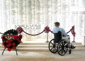 Pearl Harbor survivor Bill Johnson stares at the list of names ...