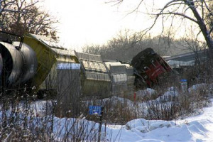 Freight trains collide; rail cars plunge into river