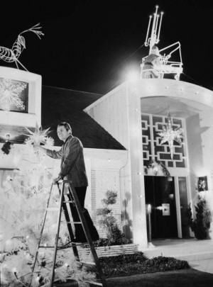 Liberace puts up Christmas decorations outside his home in Sherman ...