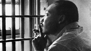 ... in a Birmingham jail cell. He became something else, scholars say