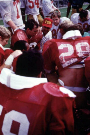FSU football players huddle with Coach Bobby Bowden. | Florida Memory