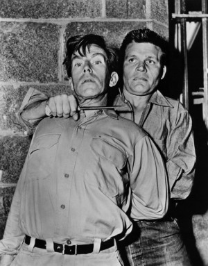 Giving Whit Bissell a close shave in Riot in Cell Block 11 (1954).