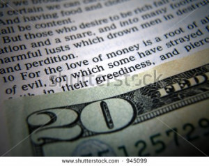 Bible verse about money next to cash - stock photo
