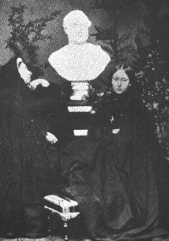 Queen Victoria & Princess Alice with a bust of Prince Albert, 1862.