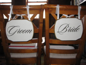 applied image of vinyl wall art quote on wood for wedding chairs
