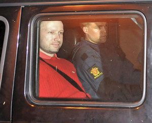 Norwegian Anders Behring Breivik transported in a police convoy as he ...