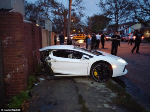 Cut in Two: The wreck of the the Lamborghini Aventador is visibly torn ...