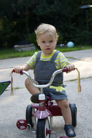 Ben loves to sit on the tricycle...already trying to grow up too fast