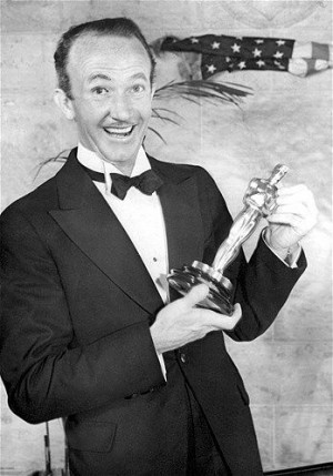 1937: Walter Brennan with his Best Supporting Actor Oscar for 