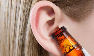 This very Thirsty chick seems to enjoy drinking beer through her ears ...