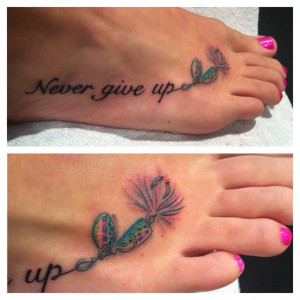 Never give up tattoo with fishing hook.
