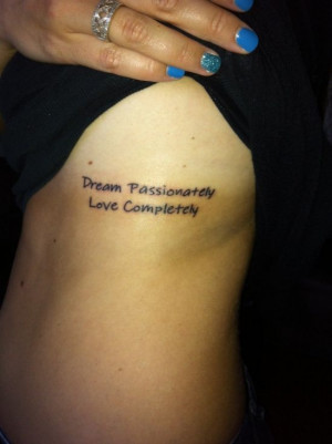 21. Amazing love quote tattoo on ribs