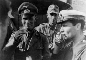 Erwin Rommel, lifting a glass in salute to the photographer, as he ...