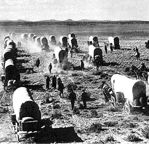 group of Mormon Pioneers going about the hard and dirty job of ...
