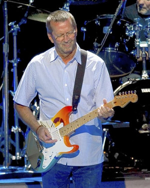 Eric Clapton performs at the Tweeter Center in Mansfield, Mass. in ...
