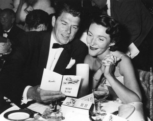 American actor Ronald Reagan and his wife Nancy Reagan sit at a ...