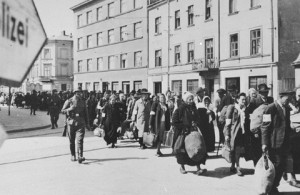 Jews walk through Krakow to Podgorze Ghetto